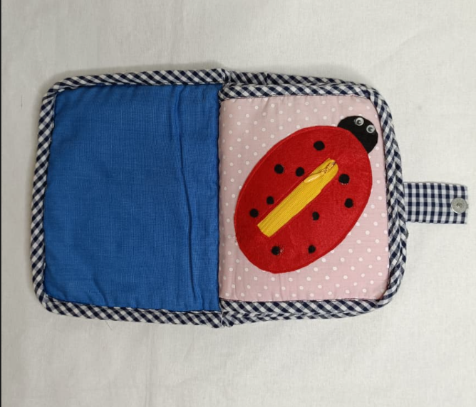 Potholder with a ladybug design on a white background